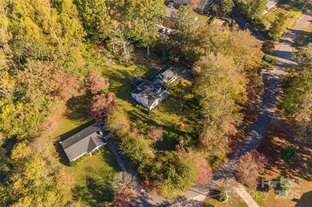 a view of a yard with swimming pool