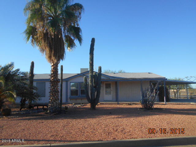 7125 West Nancy Road Peoria, AZ 85382 - Photo 1 of 39 a front view of a house with a yard and garage
