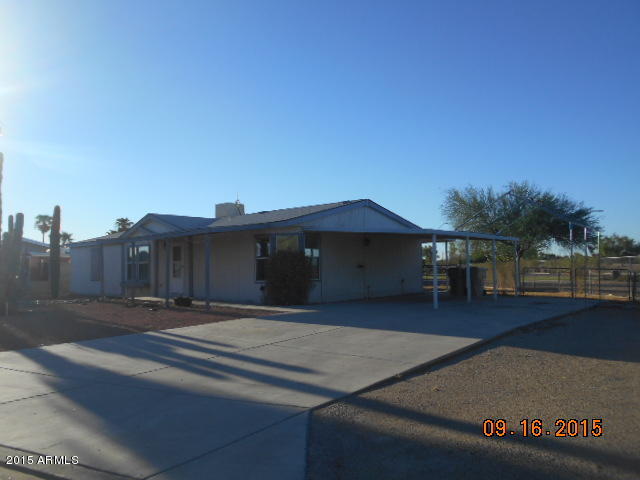 7125 West Nancy Road Peoria, AZ 85382 - Photo 2 of 39 a roof deck with table and chairs under an umbrella