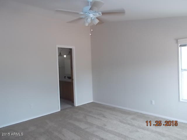 7125 West Nancy Road Peoria, AZ 85382 - Photo 27 of 39 an empty room with an entryway and fan