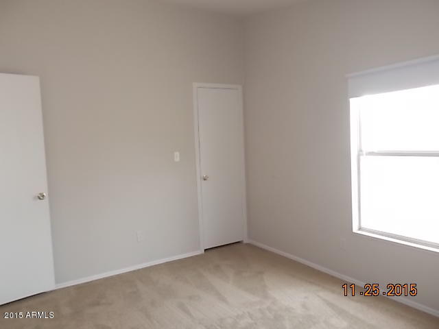 7125 West Nancy Road Peoria, AZ 85382 - Photo 3 of 39 a view of an empty room with a window