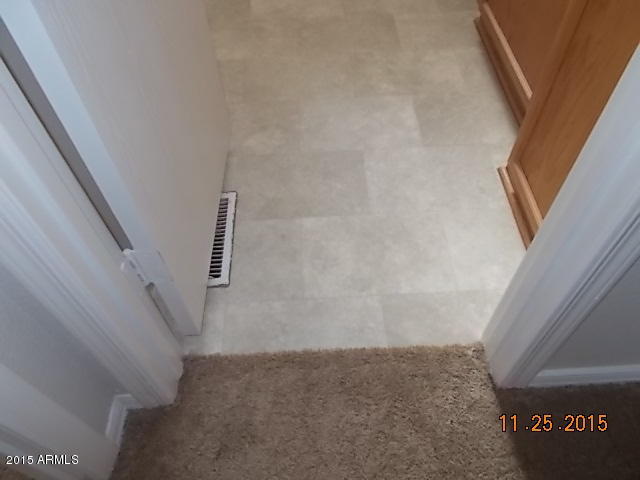 7125 West Nancy Road Peoria, AZ 85382 - Photo 32 of 39 a view of staircase with white walls and white door