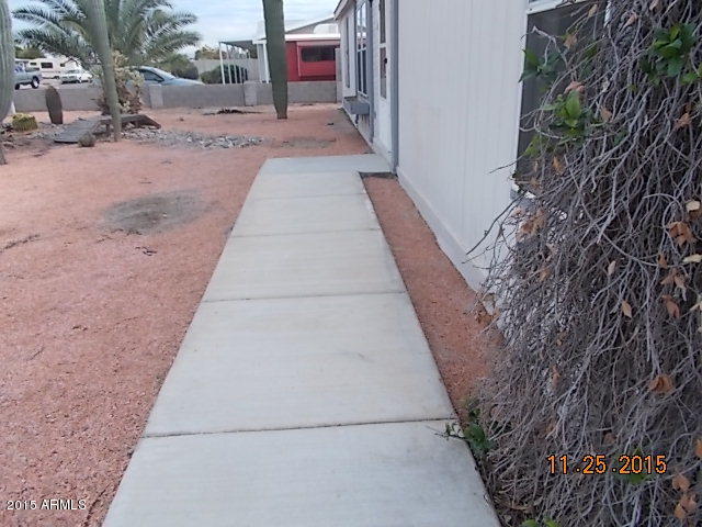 7125 West Nancy Road Peoria, AZ 85382 - Photo 34 of 39 a view of a pathway with a house