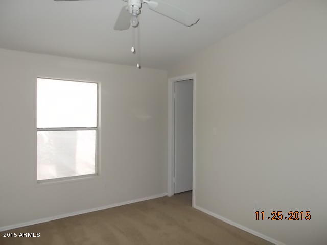 7125 West Nancy Road Peoria, AZ 85382 - Photo 4 of 39 an empty room with a window
