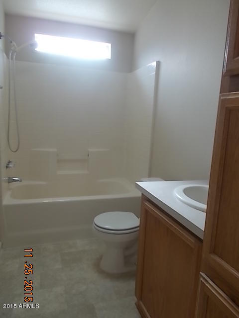 7125 West Nancy Road Peoria, AZ 85382 - Photo 6 of 39 a bathroom with a sink a toilet and shower