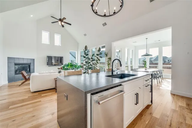 a kitchen with stainless steel appliances granite countertop a stove and a refrigerator