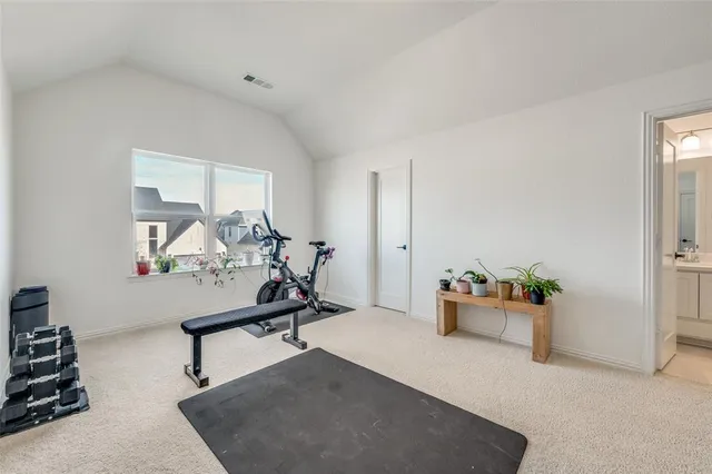 a bathroom with a granite countertop sink a toilet and mirror