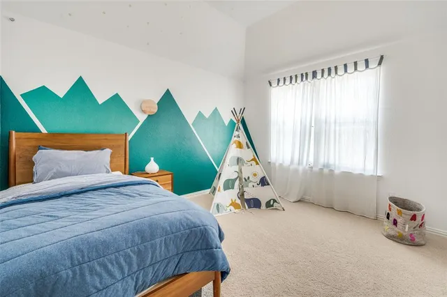 a view of a patio with table and chairs and potted plants