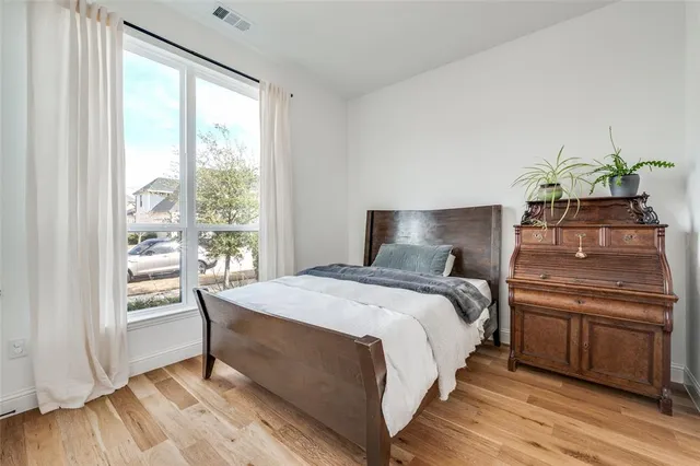 a bathroom with a toilet a sink and curtain