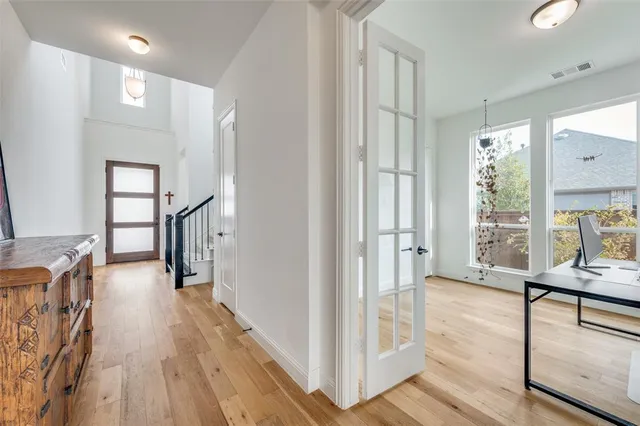 a workspace with furniture window and wooden floor