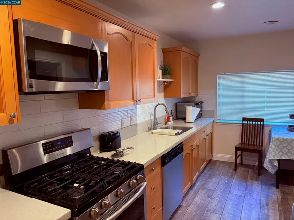 a kitchen with a stove and a microwave