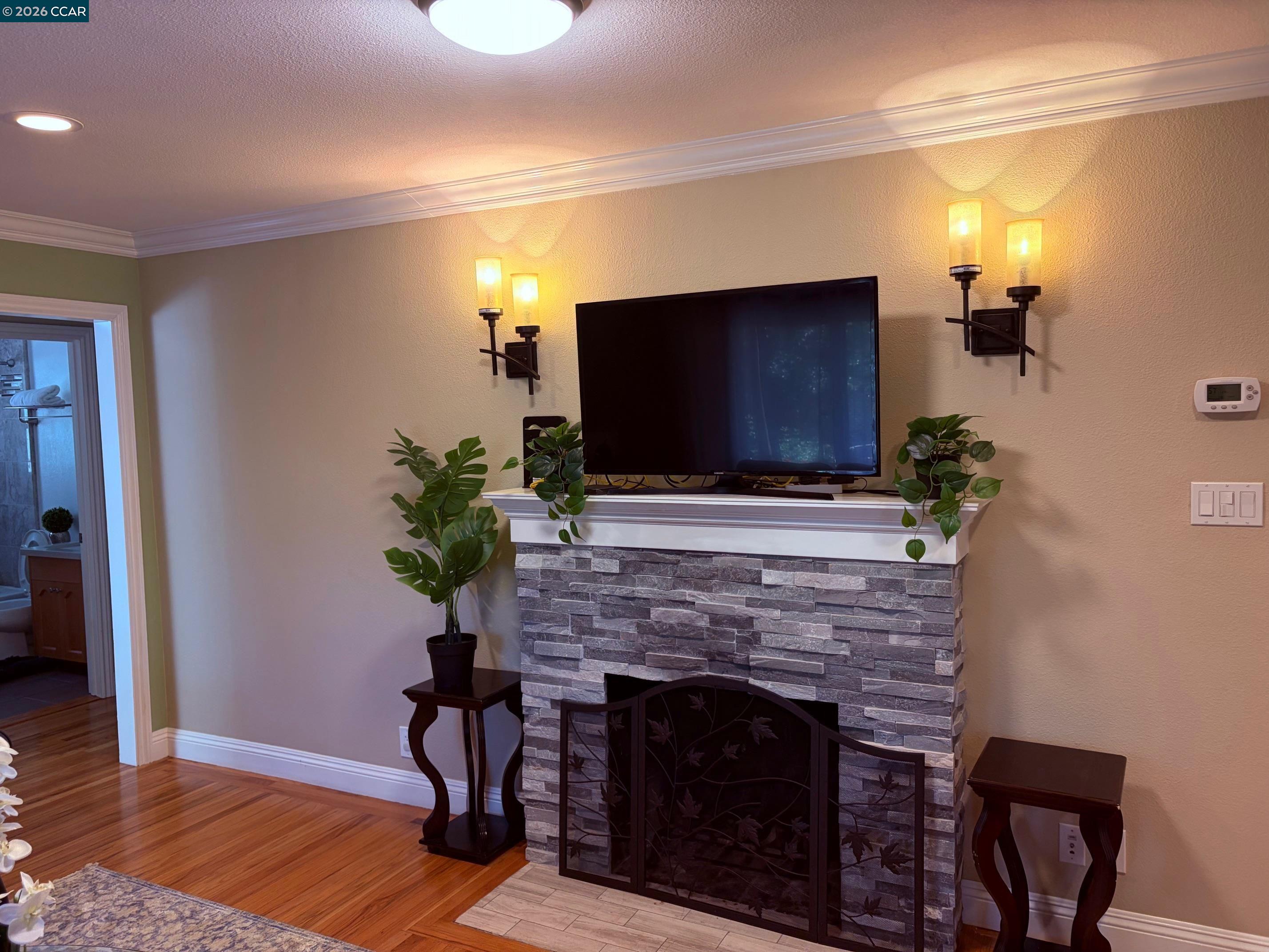 143 Pulido Road Danville, CA 94526 - Photo 6 of 27 a living room with furniture a fireplace and a flat screen tv