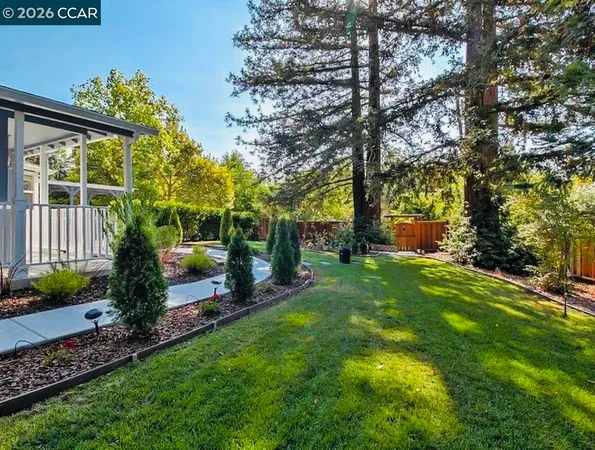 a view of a outdoor sitting area with furniture and rug