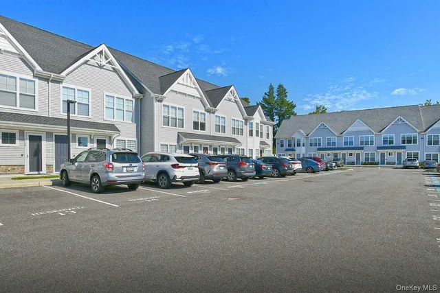 a view of a street with cars