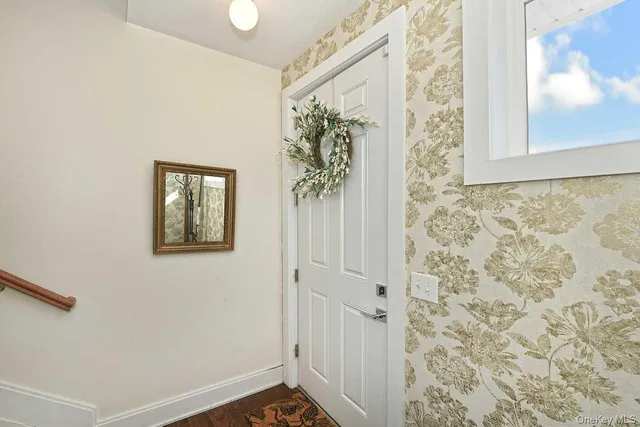 a view of a hallway with entryway