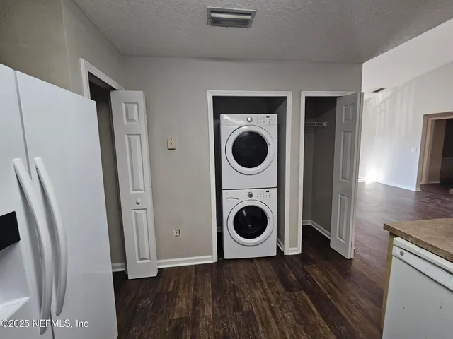 a view of a storage and utility room with washer and dryer