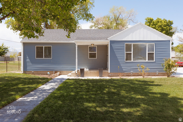Undisclosed Address Riverton, UT 84065 - Photo 1 of 1 Single-story residence featuring blue horizontal siding and a white gable accent