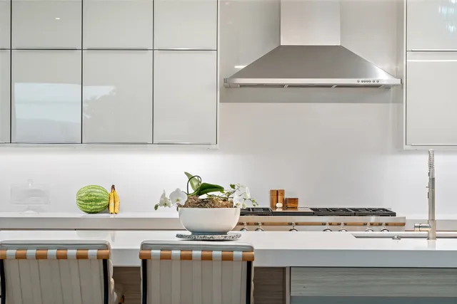 a kitchen with a stove and a cabinets