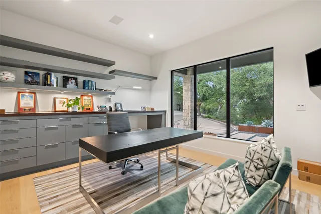 a living room with furniture and large window