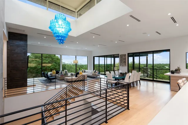 a living room with fireplace furniture and a large window