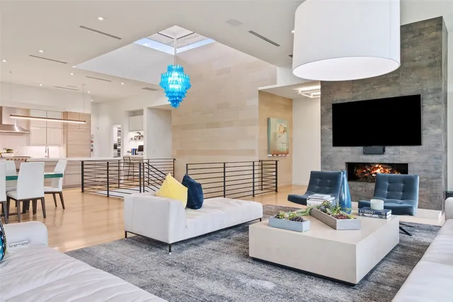 a living room with fireplace furniture and a flat screen tv