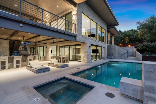 a view of a patio with swimming pool table and chairs