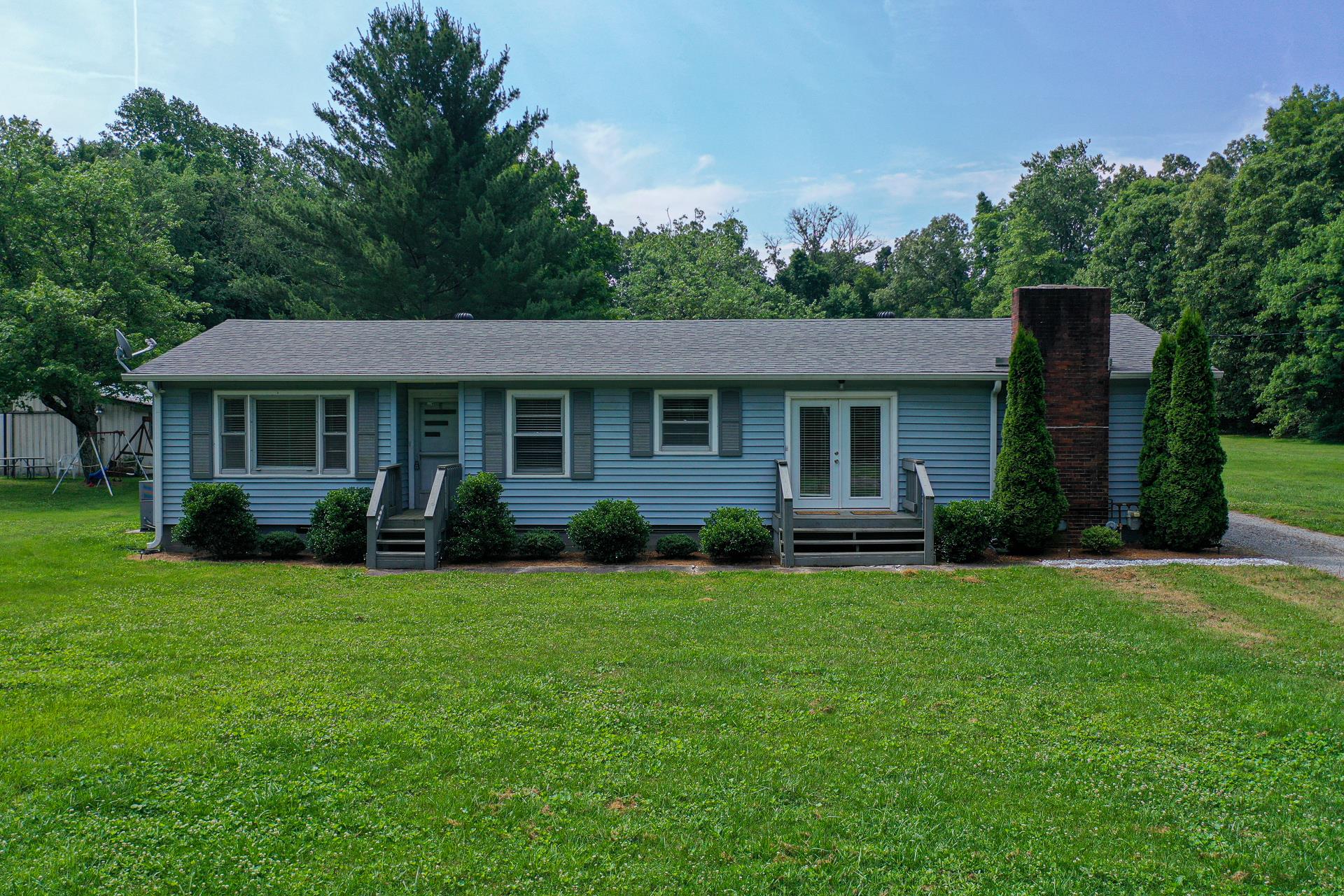 1236 Butler Bridge Road Portland, TN 37148 - Photo 1 of 22 a front view of a house with a garden