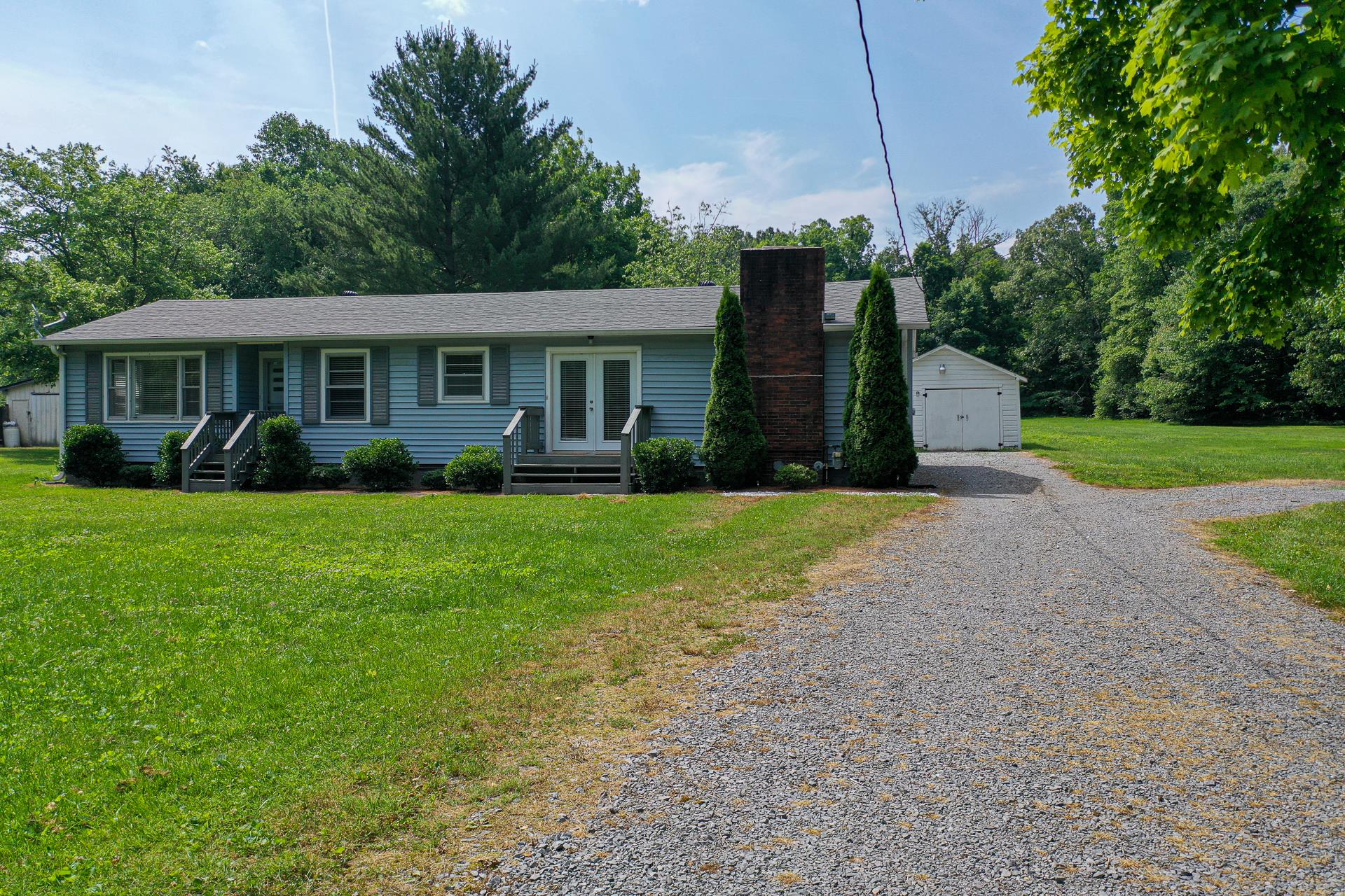 1236 Butler Bridge Road Portland, TN 37148 - Photo 2 of 22 a front view of a house with garden