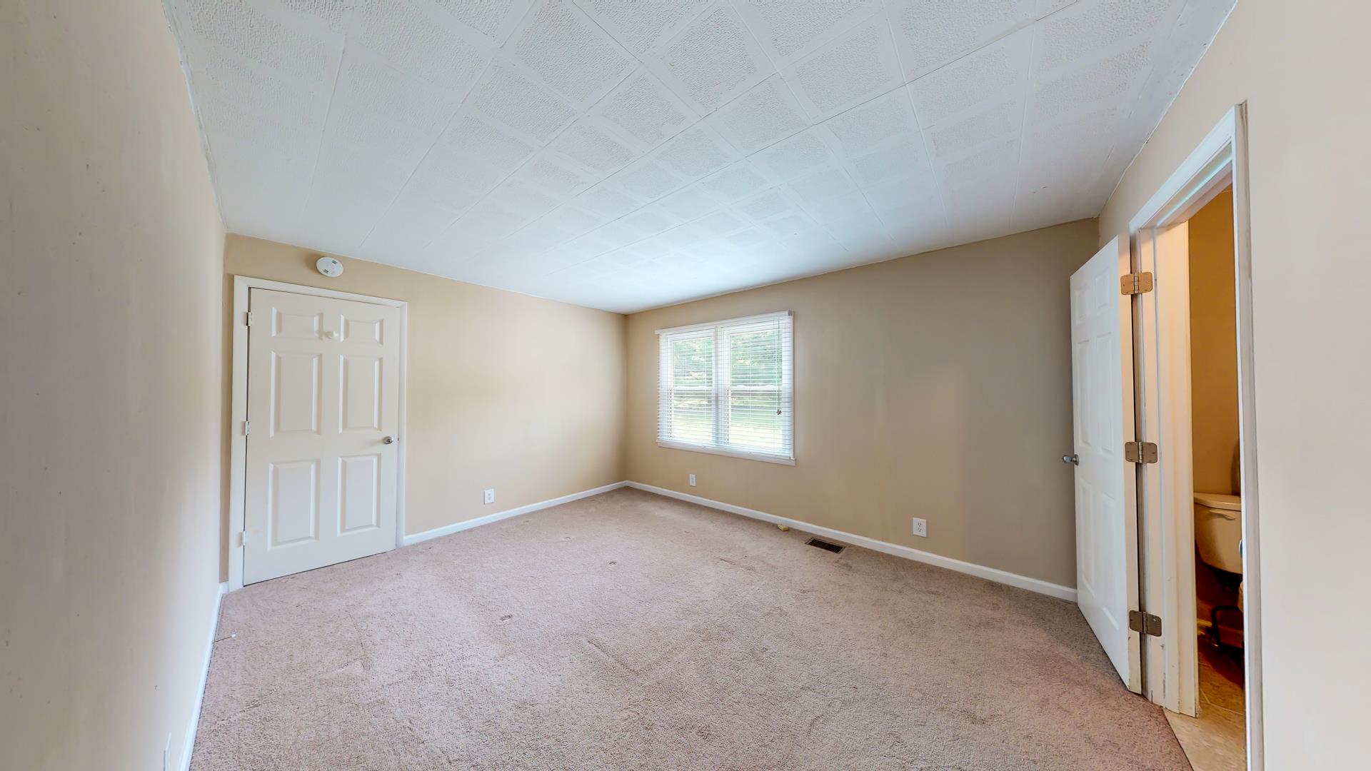 1236 Butler Bridge Road Portland, TN 37148 - Photo 11 of 22 a view of an empty room with a window