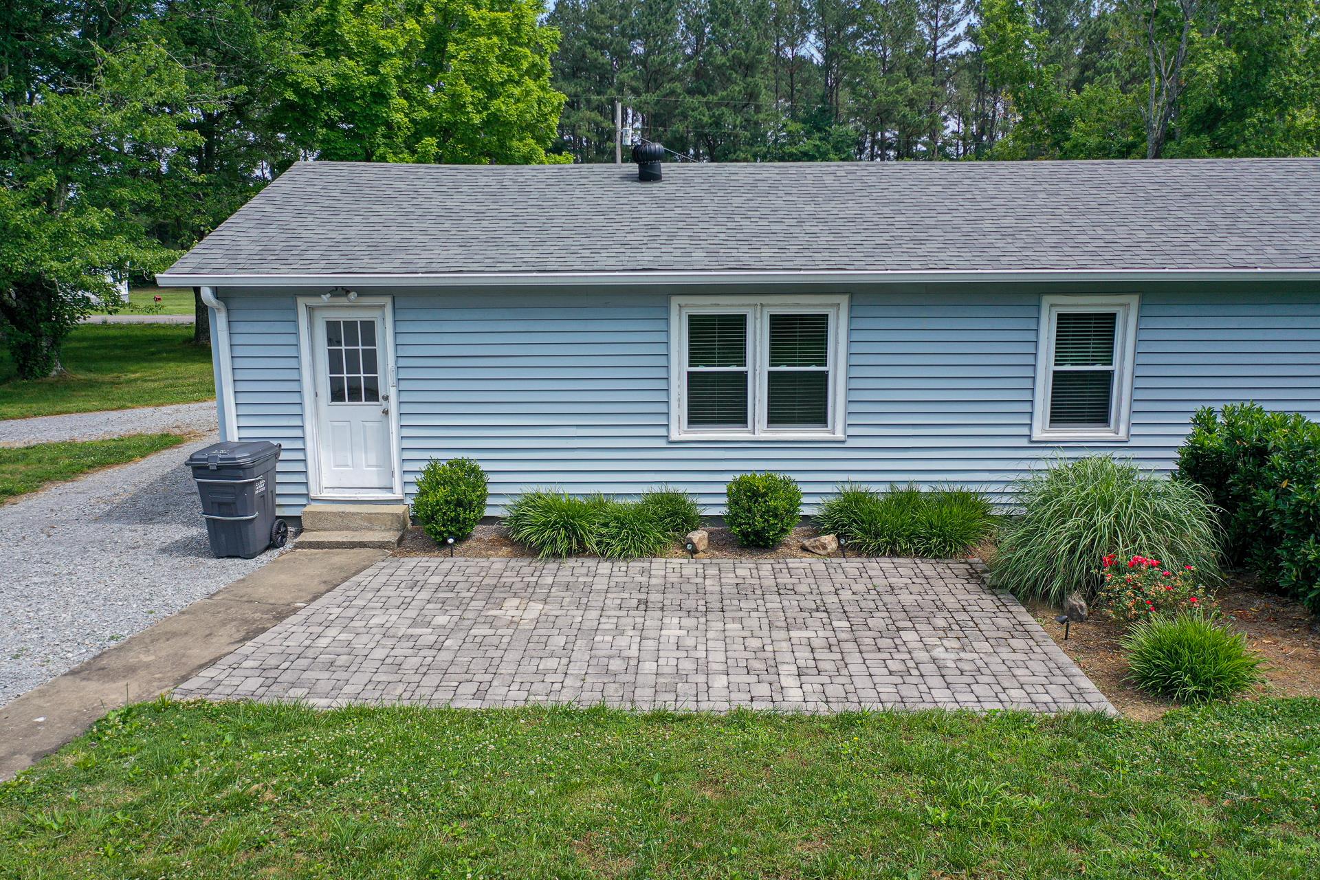 1236 Butler Bridge Road Portland, TN 37148 - Photo 18 of 22 a front view of a house with a garden and plants