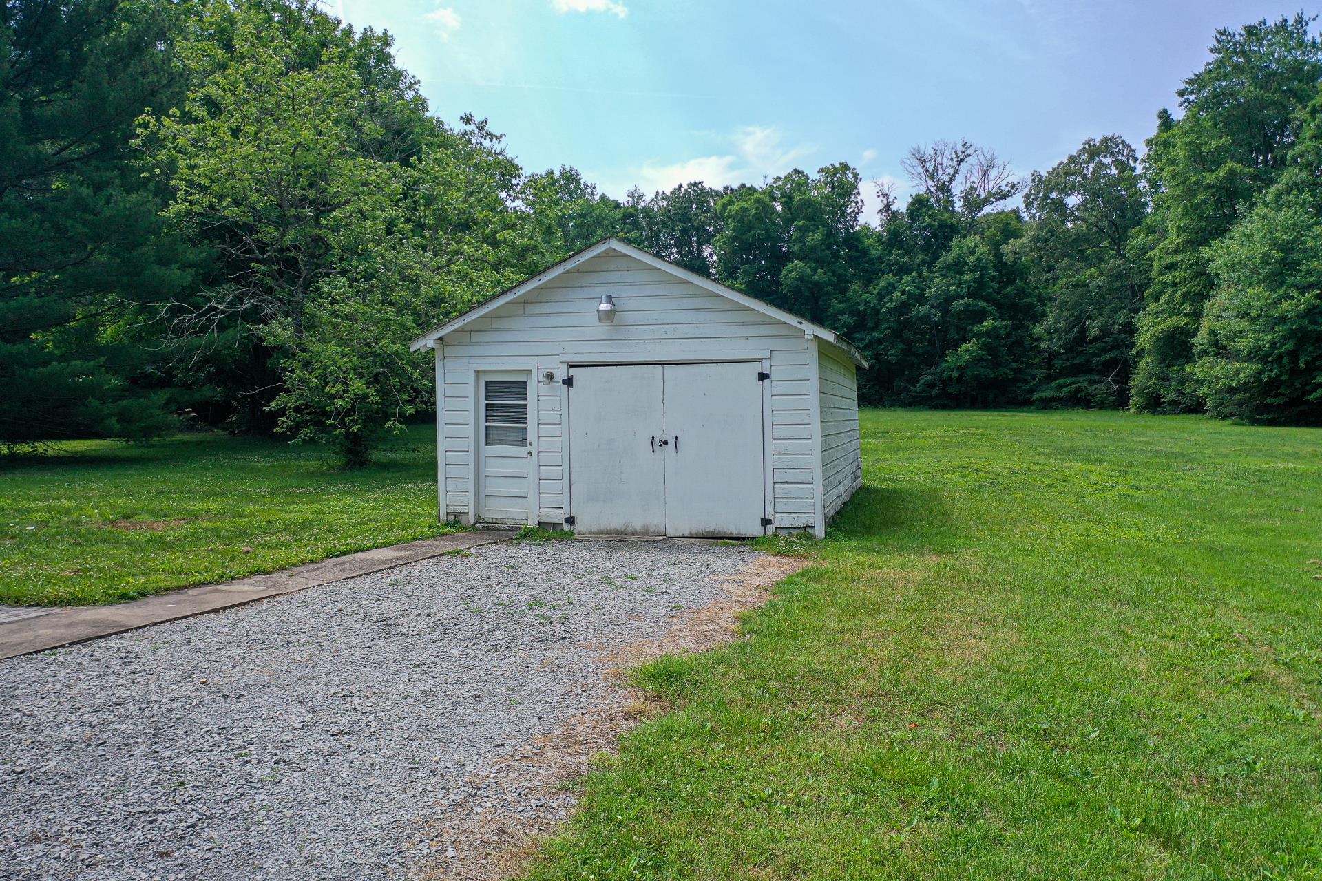 1236 Butler Bridge Road Portland, TN 37148 - Photo 20 of 22 a view of a house with backyard and garden
