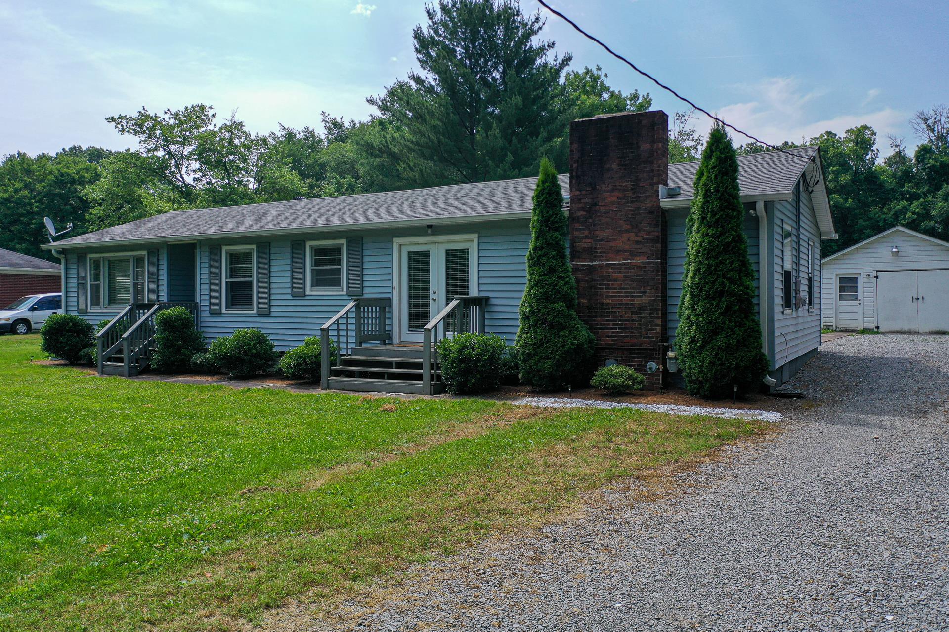 1236 Butler Bridge Road Portland, TN 37148 - Photo 3 of 22 a view of a house with backyard and garden