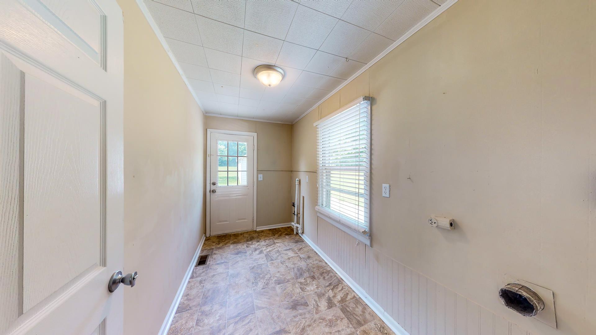 1236 Butler Bridge Road Portland, TN 37148 - Photo 22 of 22 a view of a hallway to an empty room and window