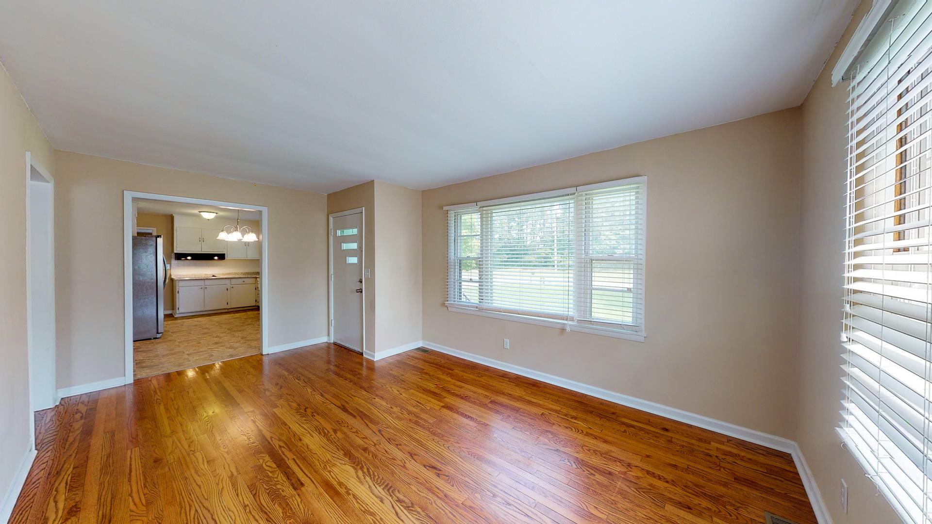 1236 Butler Bridge Road Portland, TN 37148 - Photo 7 of 22 a view of a livingroom with wooden floor and a window