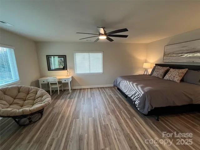 a bedroom with a bed and a couch