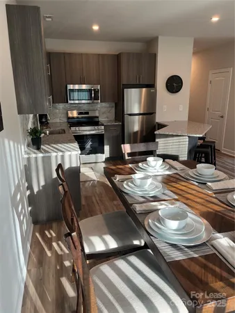 a kitchen with a sink appliances and cabinets