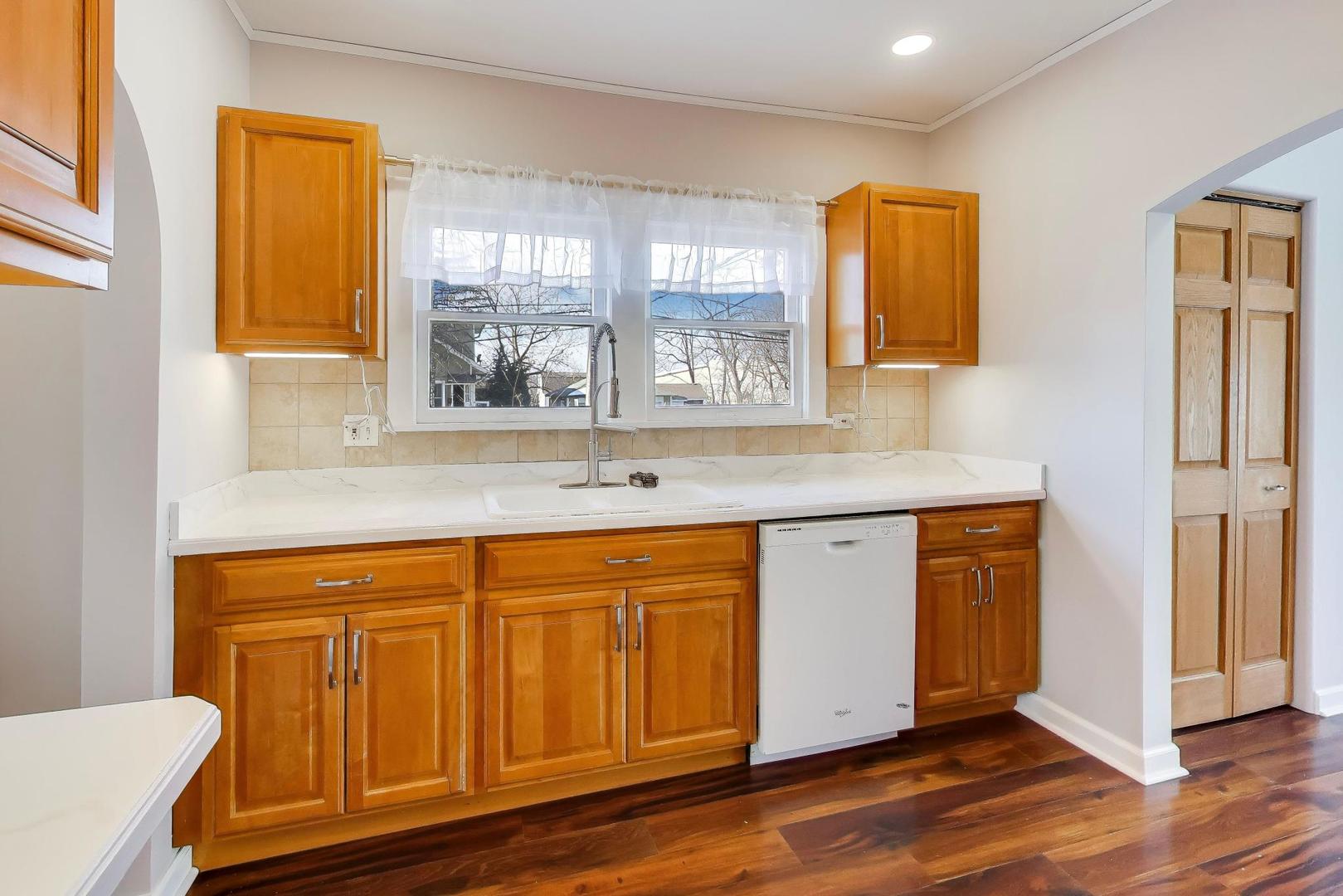 440 West Main Street Barrington, IL 60010 - Photo 14 of 32 a view of a kitchen cabinets and wooden floor