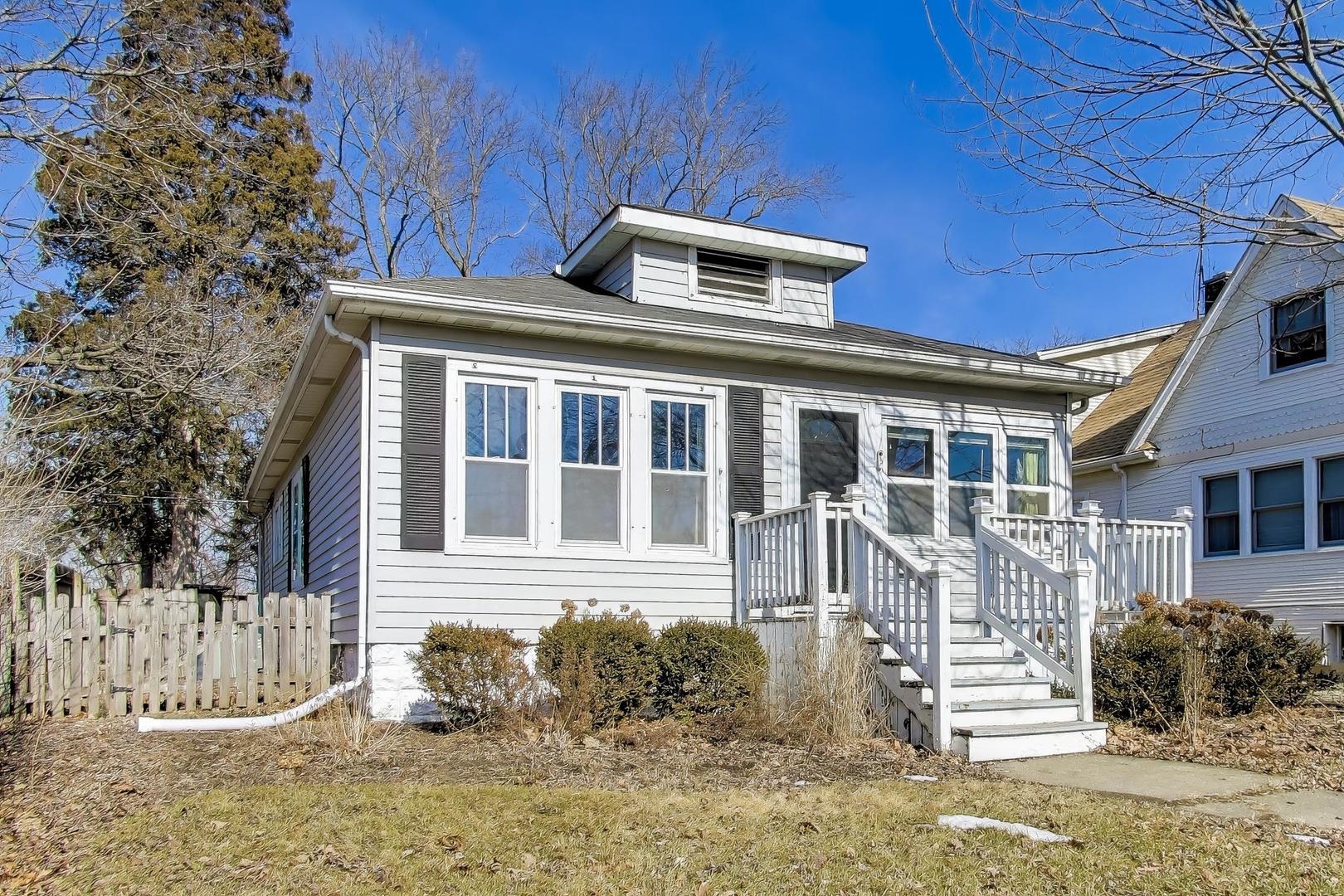 440 West Main Street Barrington, IL 60010 - Photo 2 of 32 a front view of a house with a yard