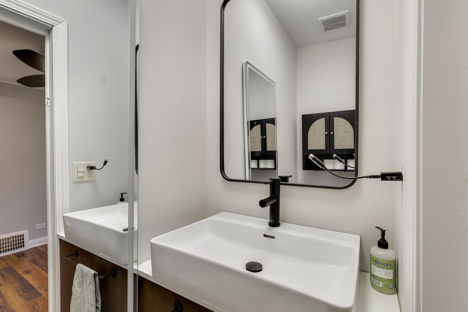 440 West Main Street Barrington, IL 60010 - Photo 21 of 32 a bathroom with a sink and mirror