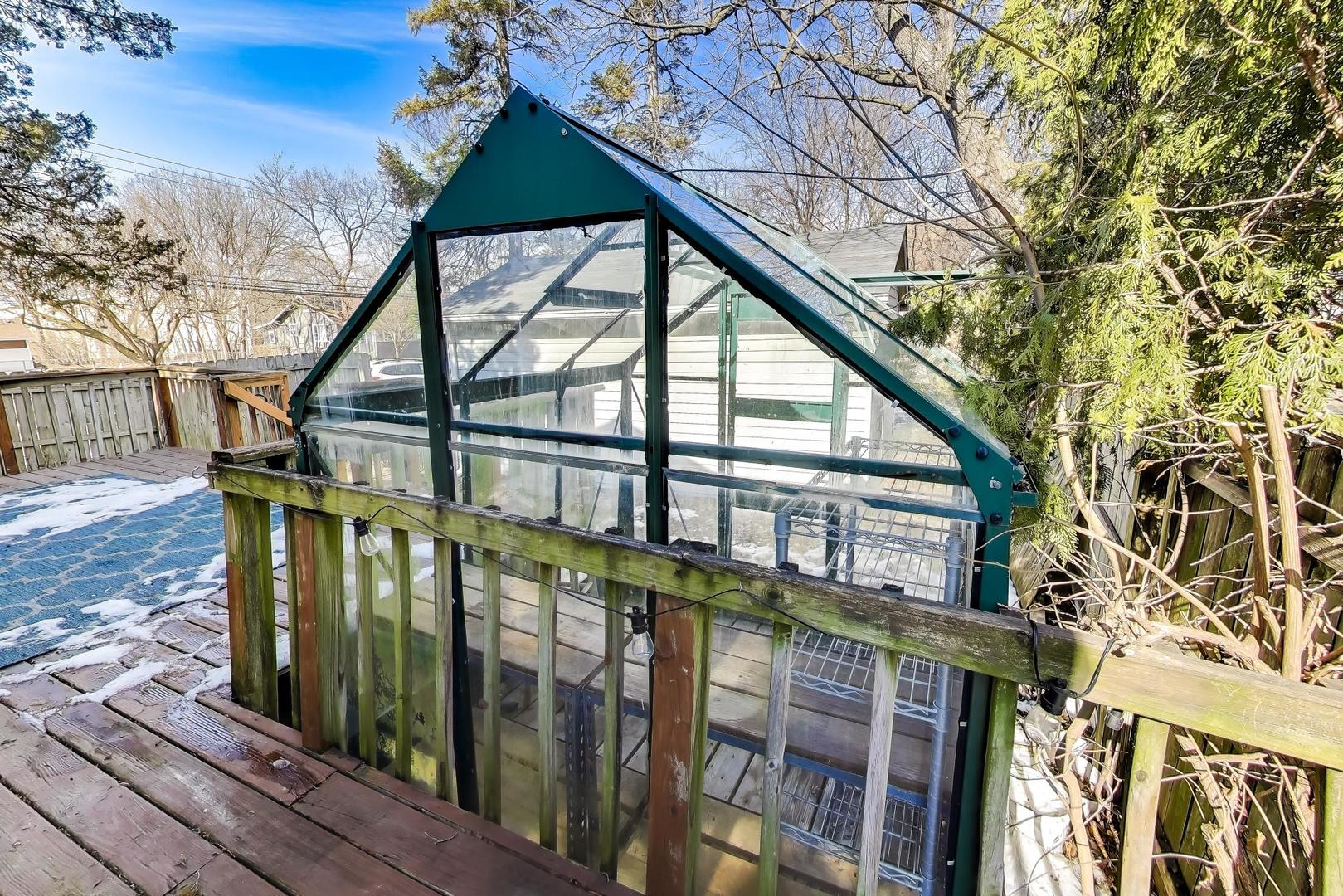 440 West Main Street Barrington, IL 60010 - Photo 28 of 32 a front view of a house with large trees and windows