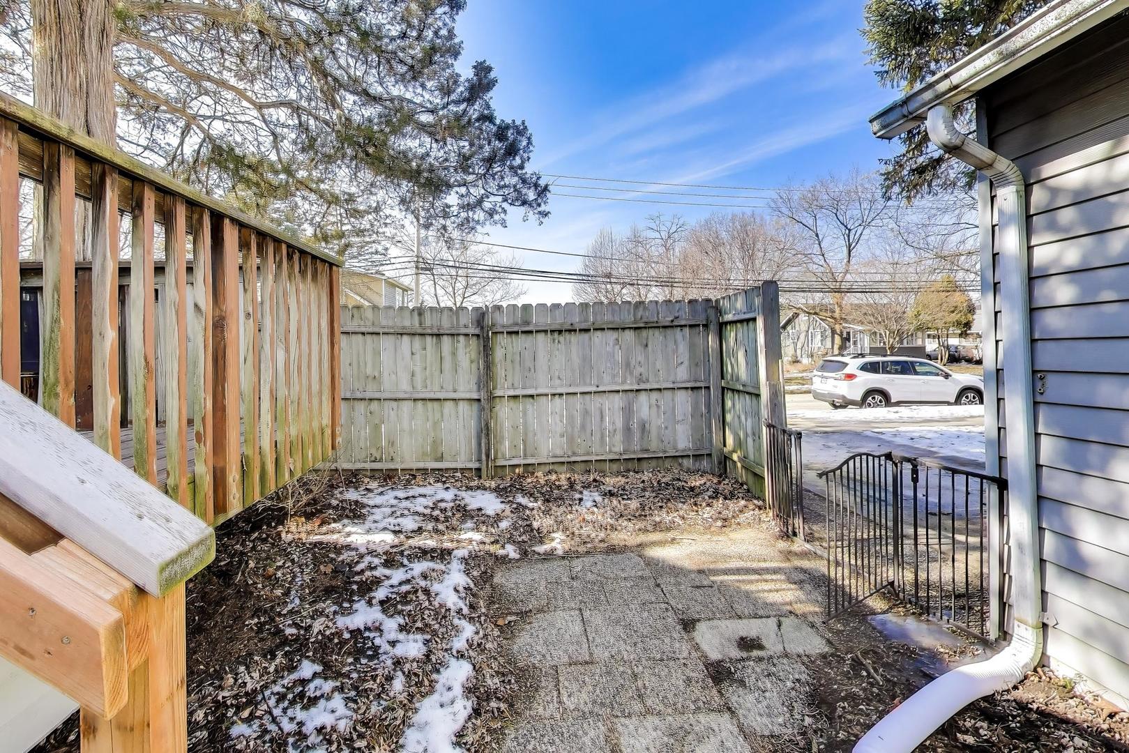 440 West Main Street Barrington, IL 60010 - Photo 30 of 32 a view of a backyard with wooden fence