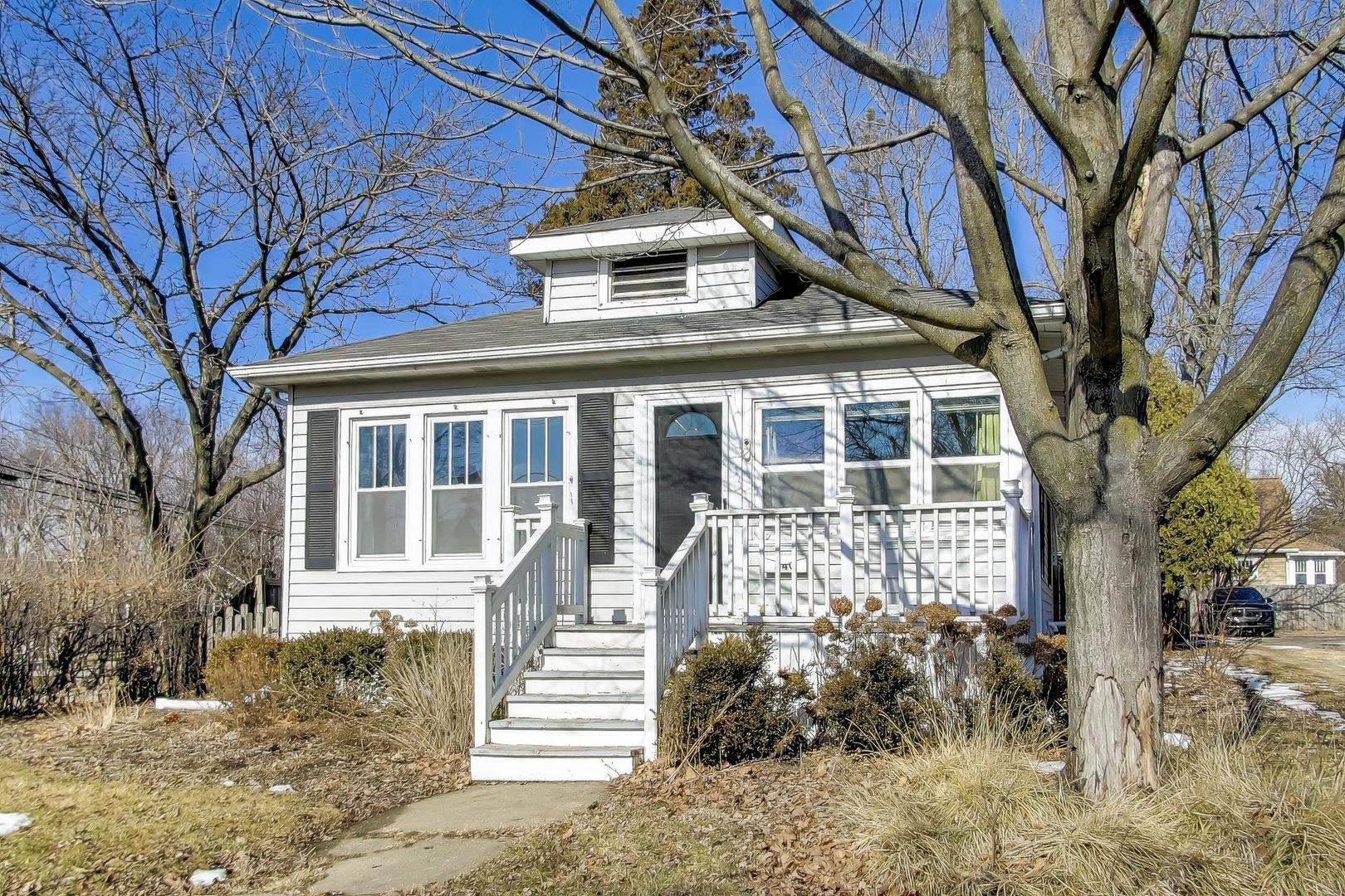 440 West Main Street Barrington, IL 60010 - Photo 3 of 32 a front view of a house with a yard