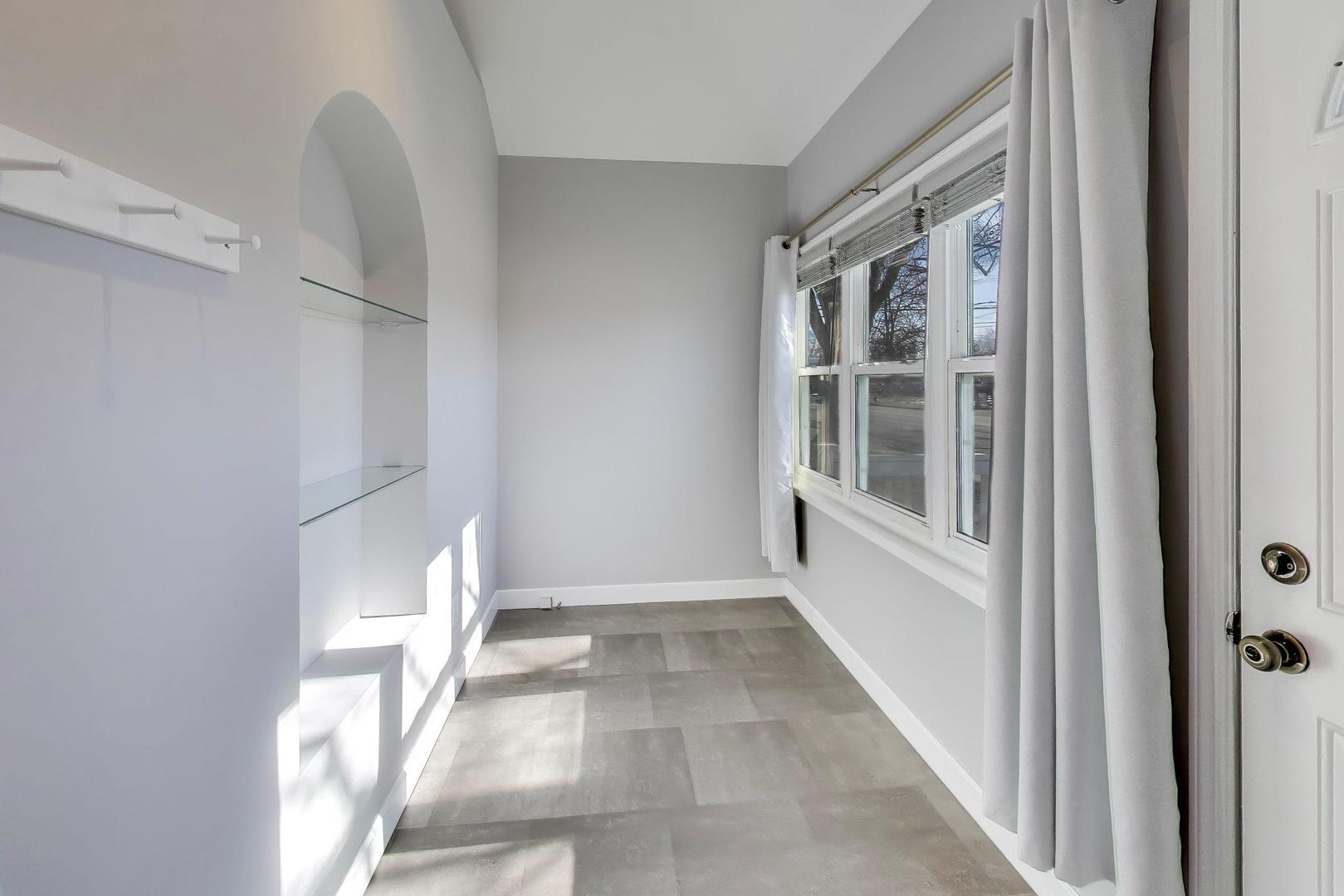 440 West Main Street Barrington, IL 60010 - Photo 5 of 32 a view of an empty room with a window