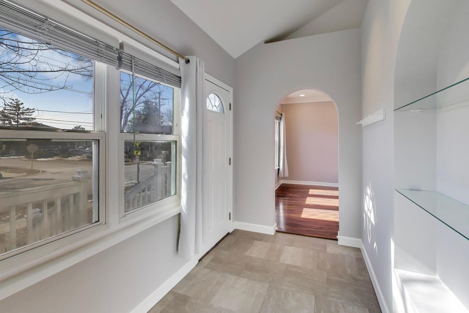 440 West Main Street Barrington, IL 60010 - Photo 6 of 32 a view of empty room with wooden floor and fan
