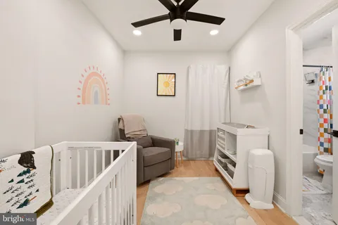 a bedroom with furniture and a chandelier