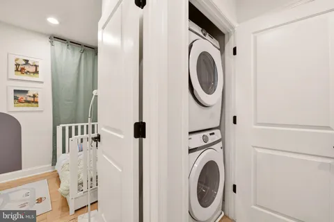 a bathroom with a sink a washer and dryer
