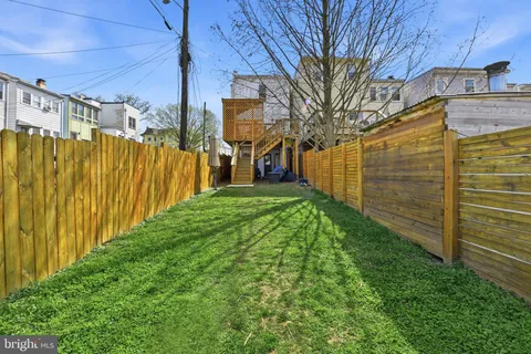 a view of a back yard of the house