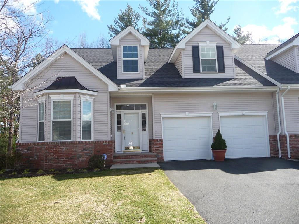 11 Haskins Road, Unit 11 Windsor, CT 06095 - Photo 1 of 1 a front view of a house with a yard