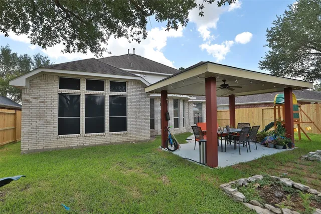 a front view of a house with a garden and porch