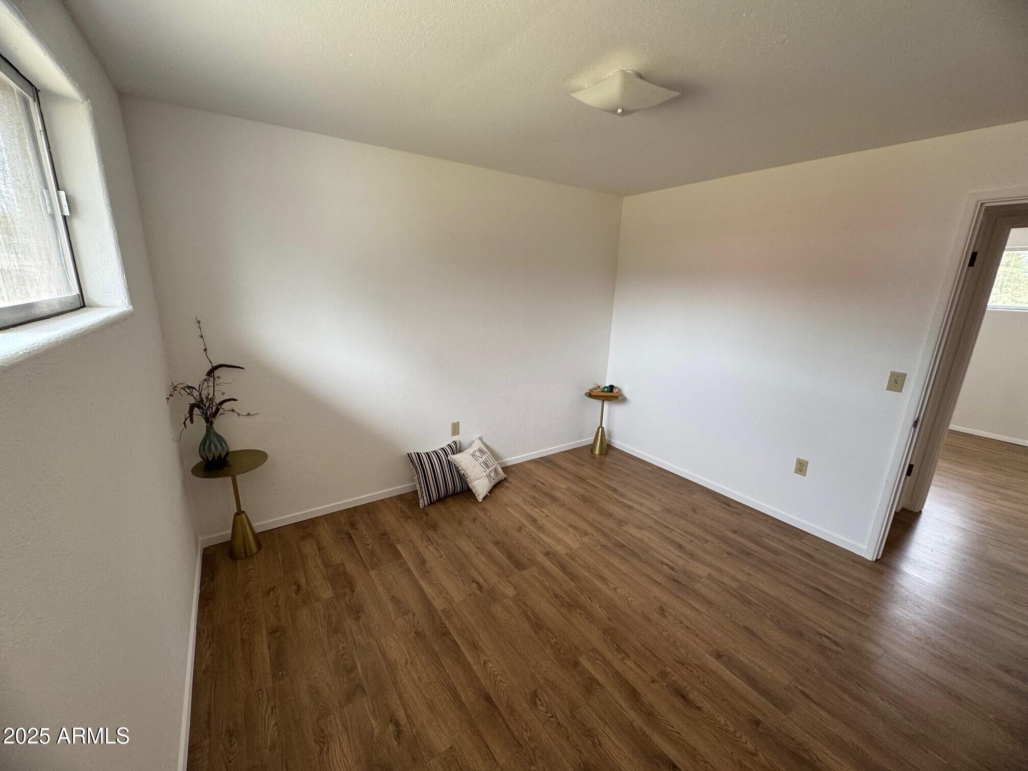 504 Alegre Place Bisbee, AZ 85603 - Photo 19 of 28 a view of empty room with wooden floor